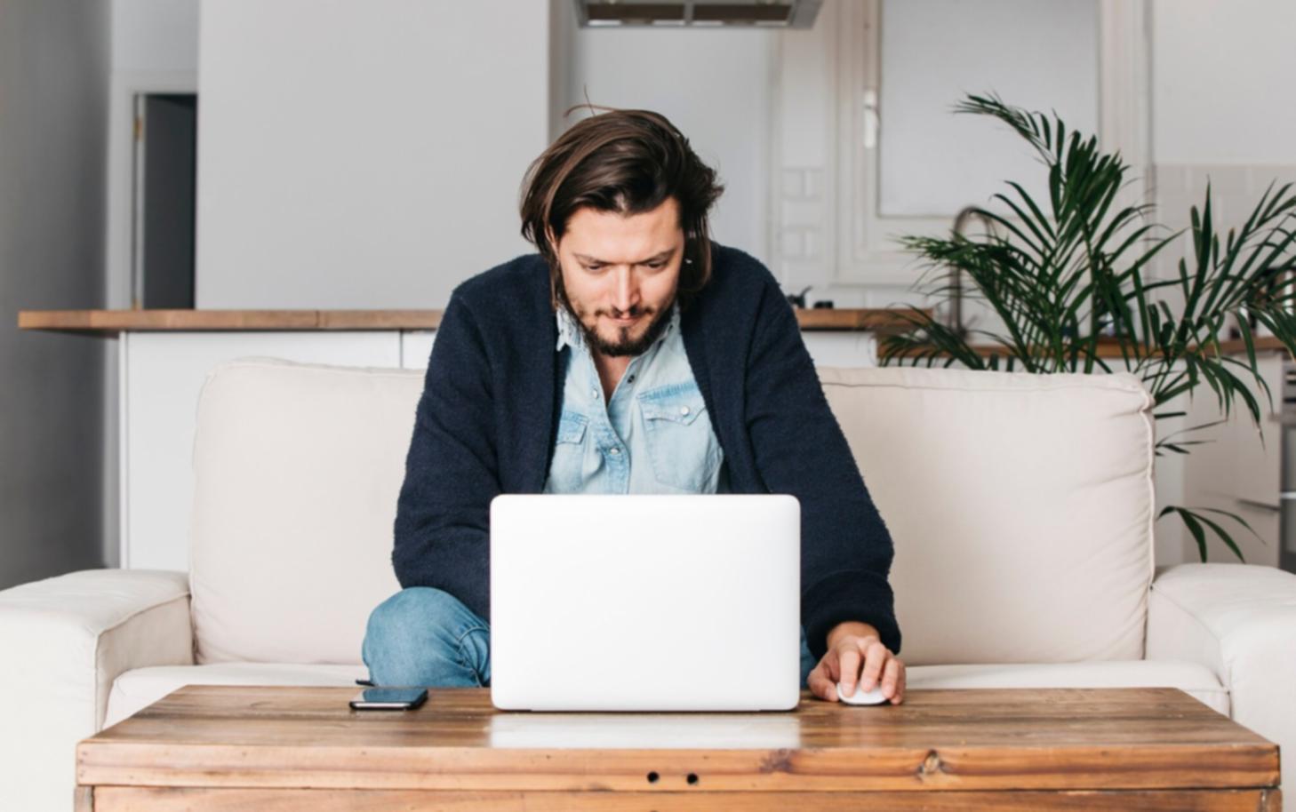 Person reviewing financial documents at a desk